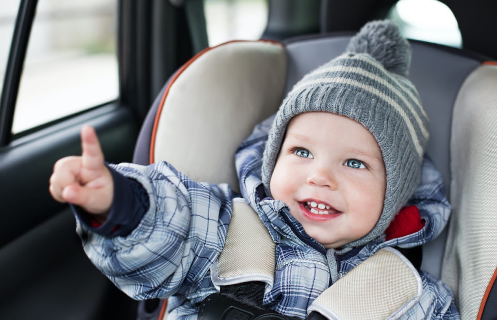 Baby in car seat in winter